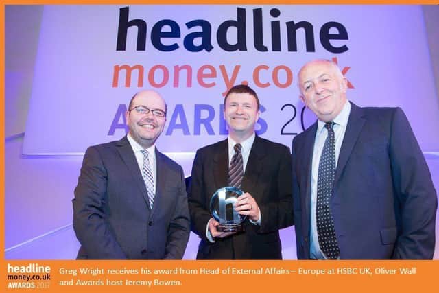 Greg Wright of The Yorkshire Post receives his headlinemoney.co.uk award from Oliver Wall, head of external affairs - Europe at HSBC and awards host Jeremy Bowen