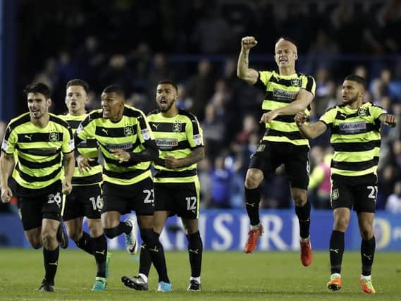 Jonathan Hogg leaps for joy as the Huddersfield Town players realise they're heading to Wembley