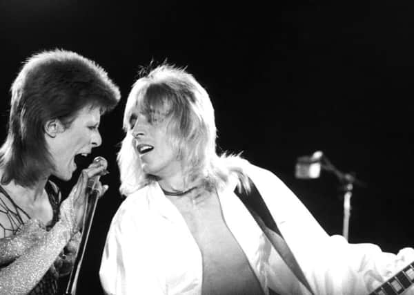David Bowie performing with Mick Ronson at a live recording for a Midnight Special TV show made at The Marquee Club in London with a specially invited audience of Bowie fanclub members in 1973. (Photo by Jack Kay/Daily Express/Hulton Archive/Getty Images).