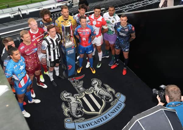 Players from the 12 teams pose for a photograph during a media day at St James' Park, Newcastle.