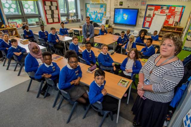 Year 6 class teacher Simon Hall, with headteacher Jill Wood, and pupils who didn't sit this years SATS tests. Picture James Hardisty.