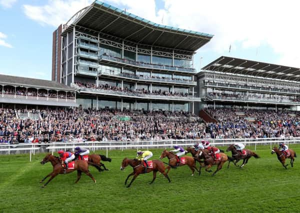 Duke Of Firenze (left) ridden by jockey David Allan on the way to winning the Betfred Supports Jack Berry House Handicap during day two of the Dante Festival at York Racecourse