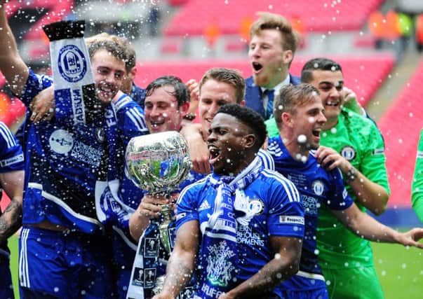 Wembley joy: FC Halifax Town players celebrate winning the  FA Trophy 12 months ago.