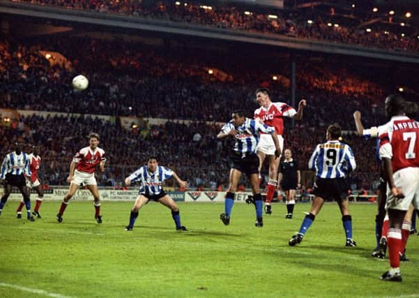 dramatic intervention: Andy Linghan, centre, rises above Mark Bright to power a header past Chris Woods in the Sheffield Wednesday goal in the 120th-minute of the 1993 FA Cup final replay.  (Pictures: PA)
