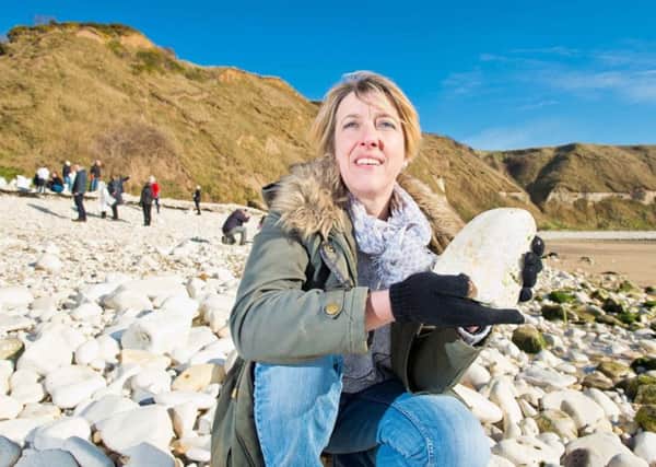 NATURAL CHOICE: Tracy Foster at Flamborough South Cliff with some of the 2,000 tonnes of pebbles that she has borrowed for the Welcome to Yorkshire Garden at the Chelsea Flower Show.