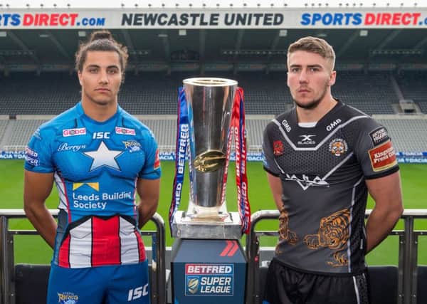 Leeds's Ashton Golding & Castleford's Greg Minikin with the Betfred Super League trophy ahead of their Magic Weekend game.
