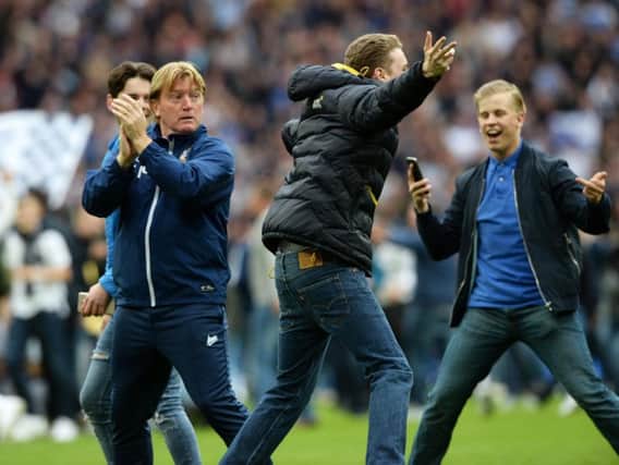 Bradford City boss Stuart McCall is interrupted as he applauds the Bantams fans