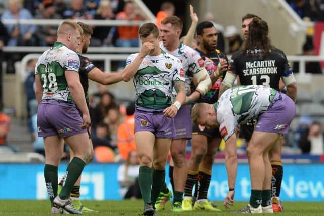 ABJECT: Hull FC players show their dismay at the end of their 45-0 Magic Weekend defeat to St Helens. Picture: Anna Gowthorpe/PA.