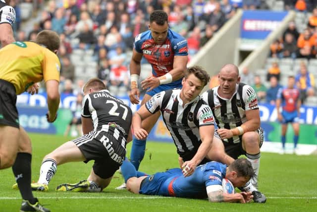 Wakefield Trinity's Scott Grix scores a try against Widnes at St James' Park. Picture: Anna Gowthorpe/PA