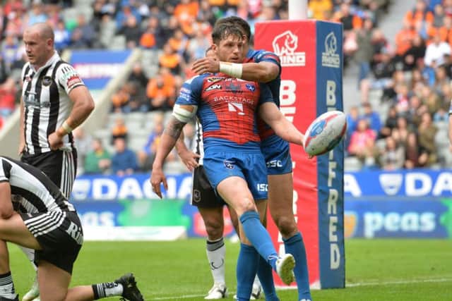 Wakefield Trinity's Scott Grix celebrates after scoring a try at St James' Park. Picture: Anna Gowthorpe/PA