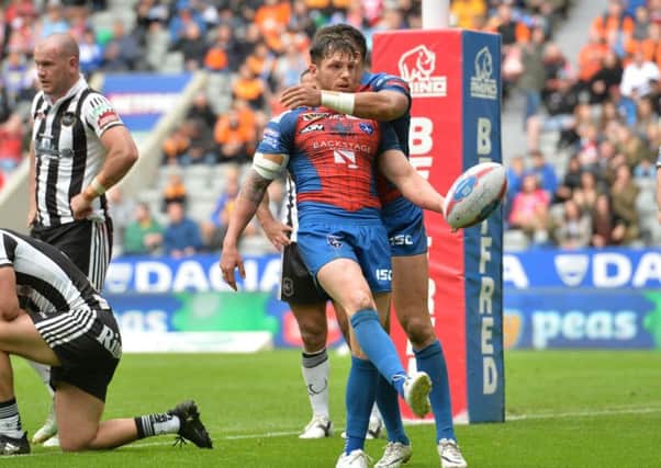 Wakefield Trinity's Scott Grix celebrates after scoring a try at St James' Park. Picture: Anna Gowthorpe/PA