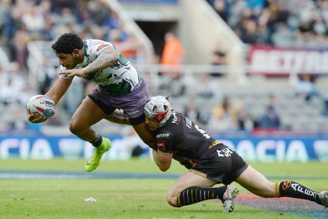 GOING NOWHERE: Hull FC's Albert Kelly is tackled by St Helens' Theo Fages at St James' Park. Picture: Anna Gowthorpe/PA