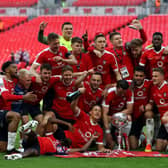 York City players celebrate winning the Buildbase FA Trophy Final at Wembley.