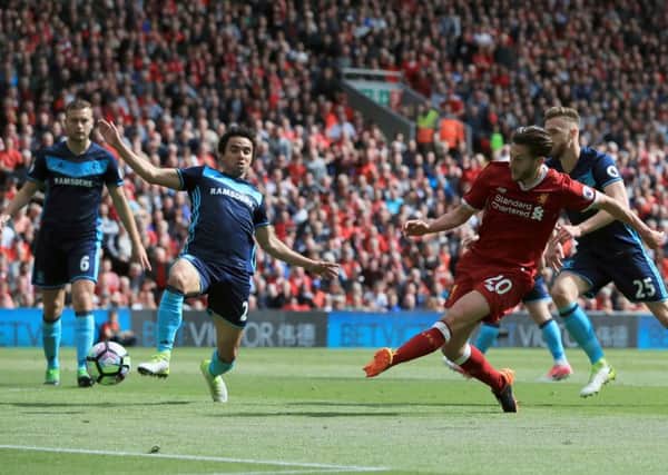 Liverpool's Adam Lallana scores his side's third goal against Middlesbrough. Picture: Peter Byrne/PA