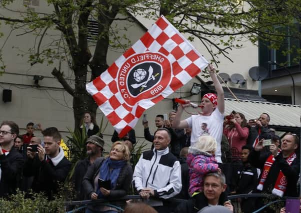 Sheffield United fans wait to see the players during the open top bus parade from Bramall Lane Stadium to Sheffield Town Hall, Sheffield. Picture: Simon Bellis/Sportimage
