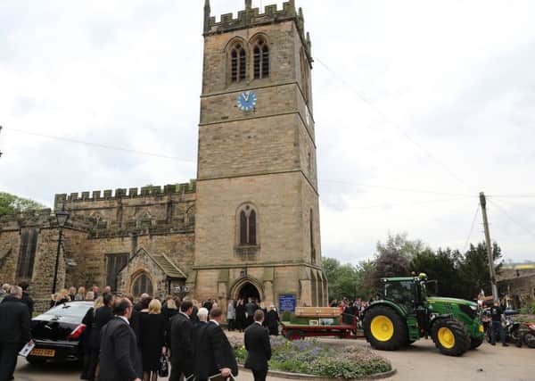 The funeral cortege made up of a tractor and bikers, for the funeral of farmer and motocross rider Thomas Brown, 27, from Barnard Castle, arrives at St Mary's Church, in Barnard Castle. PIC: PA