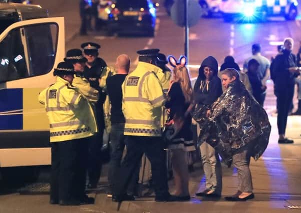 Emergency services at Manchester Arena following an explosion at the venue during an Ariana Grande concert. Picture: Peter Byrne/PA Wire