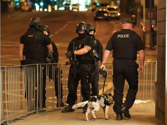 Police officers in Manchester after last night's suspected terror attack