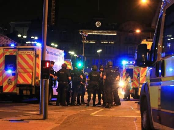 Police officers in Manchester after last night's terror attack