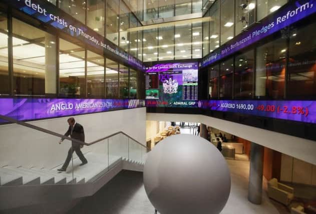 A view of the information screens at the London Stock Exchange in the City of London Photo: Yui Mok/PA Wire