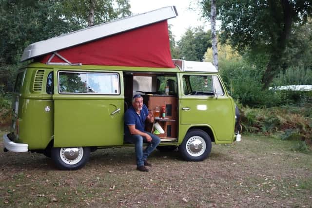 Paul Hollywood dines on Currywurst from the comfort of the Volkswagen Kombi, in Braunschweig, Germany.Photo/BBC/Nathaniel Bullen.