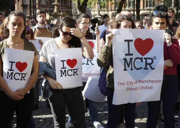 People gather ahead of a vigil in Albert Square, Manchester, in the wake of the terrorist attack. (PA).