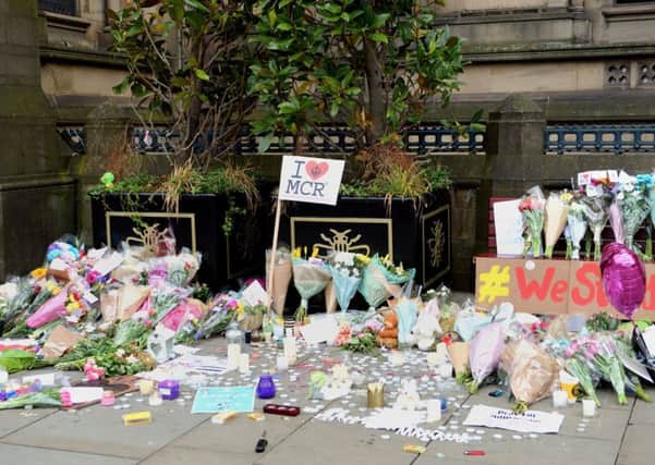 Floral tributes left by Manchester Town Hall. PIC: PA