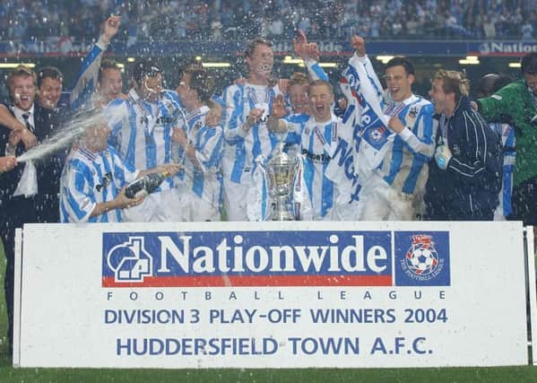 Huddersfield Town celebrate after beating Mansfield Town on penalties in the Division Three play-off final in Cardiff in 2004.