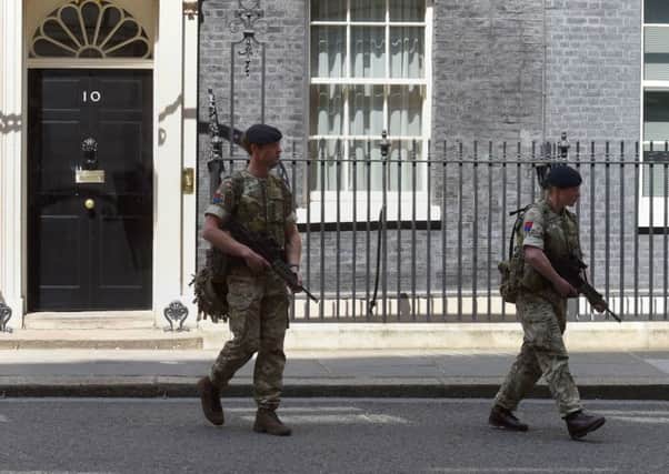 Troops patrol 10 Downing Street.