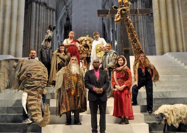 The Archbishop of York, Dr John Sentamu, on stage  at York Minster  with some of the cast  of the Mystery Plays