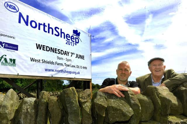 David Smith (left) and his father John Smith by the sign for NSA North Sheep 2017 on their farm near Tow Law.