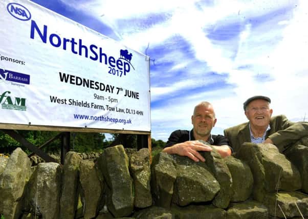 David Smith (left) and his father John Smith by the sign for NSA North Sheep 2017 on their farm near Tow Law.