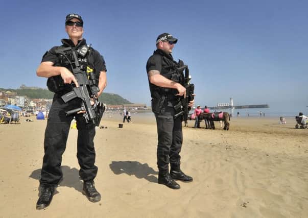 Armed police patrol South Bay, Scarborough, following Monday night's terror attack in Manchester.