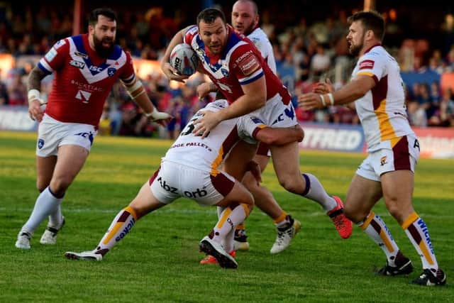 Wakefield's Keegan Hirst battles with Martyn Ridyard and Paul Clough. Picture: Paul Butterfield.