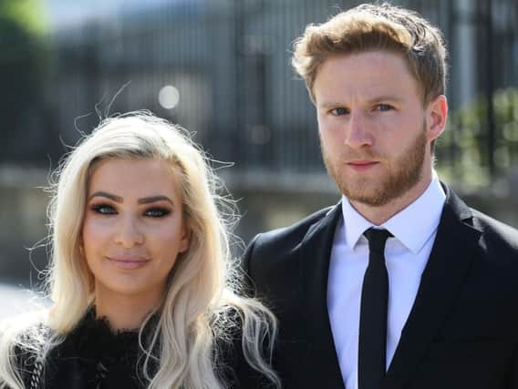 Model Laura Lacole and footballer Eunan O'Kane outside the High Court in Belfast where a landmark legal case by the pair to secure official recognition of their humanist wedding is being heard.