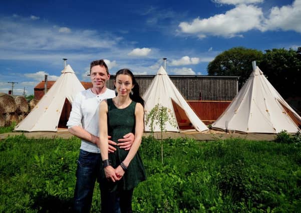 Di Hammill pictured on the farm with her partner Lee Wood. Picture by Simon Hulme