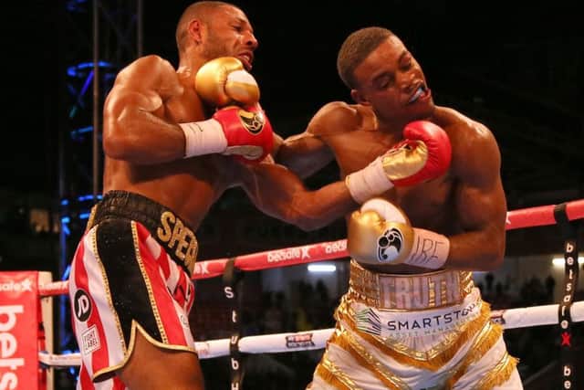Kell Brook (left) and Errol Spence trade blows at Bramall Lane. Picture: Richard Sellers/PA