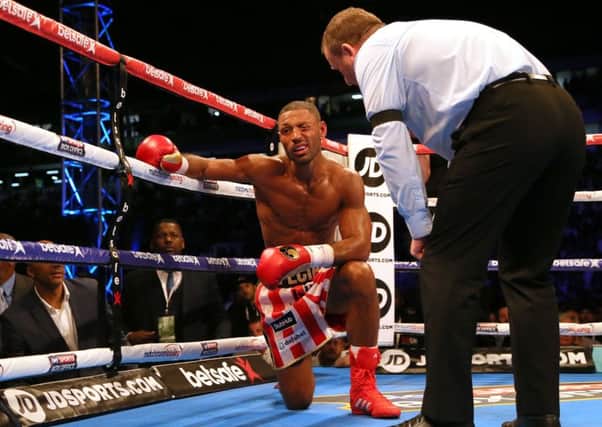 Kell Brook winces after being stopped by Errol Spence at Bramall Lane. Picture: Richard Sellers/PA