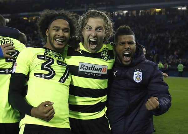 Huddersfield Town's Isaiah Brown and Michael Hefele celebrate winning on penalties at Hillsborough. Picture: Martin Rickett/PA