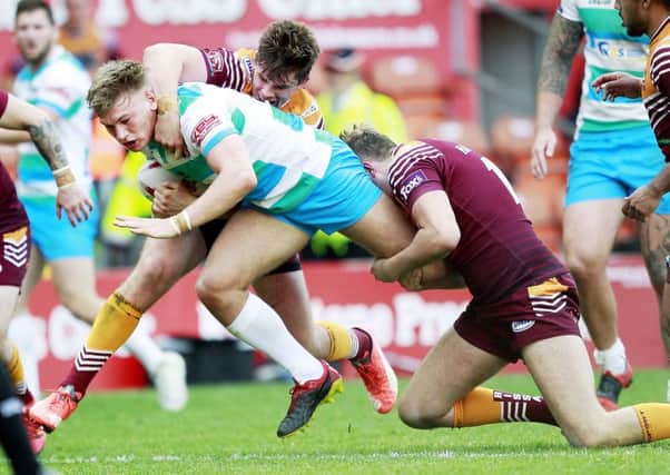 Batley's Daniel Cowling and James Harrison  tackle Dewsbury's Billy Hayes. Picture: SWpix.com
