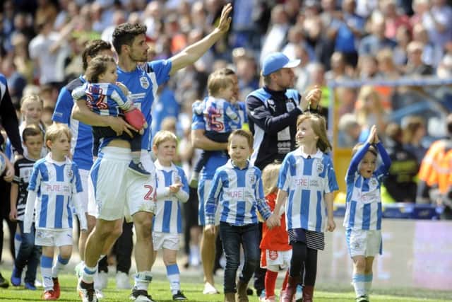 Huddersfield Town's Christopher Schindler does a lap of honour at the final home game of the season. Picture by Simon Hulme