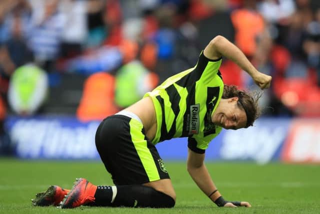 Huddersfield Town's Michael Hefele fails to score from the penalty spot during the shoot-out. Picture: Mike Egerton/PA