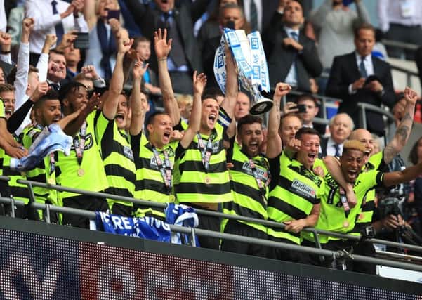 Jubilant Huddersfield Town players after winning promotion.