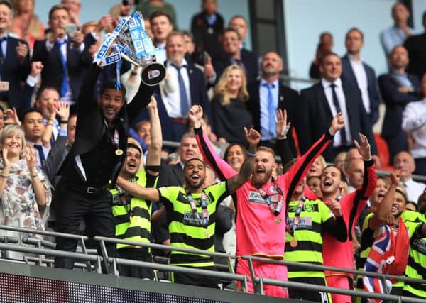 Huddersfield Town manager David Wagner lifts the trophy as they celebrate winning the Sky Bet Championship play-off final at Wembley StadiumPicture: Mike Egerton/PA
