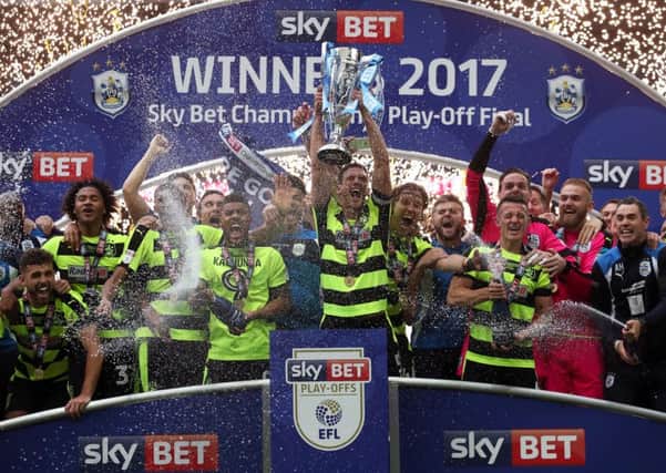 Huddersfield Town's Mark Hudson lifts the trophy  at Wembley. Picture: Nick Potts/PA