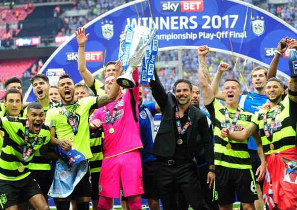 Head coach David Wagner and his Huddersfield Town team hoist the Championship play-off final trophy after beating Reading (Picture: Simon Hulme).