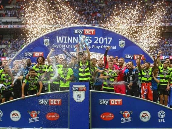 The pictures that prove it... Huddersfield Town are in the Premier League.