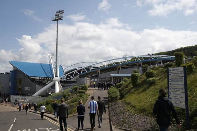 Fans walk to the John Smiths Stadium, Huddersfield.