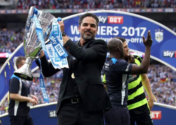 Huddersfield Towns head coach David Wagner holds the Championship play-off final trophy (Picture: PA Wire).