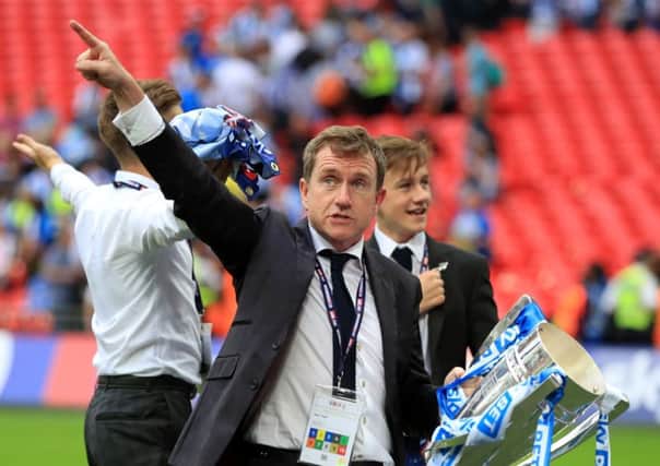 Huddersfield Town's chairman Dean Hoyle celebrates with the trophy after the Championship play-off final at Wembley (Picture: Mike Egerton/PA Wire).
